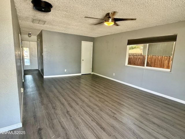 540 Anthony Ln, Fallon, NV 89406 - empty room featuring ceiling fan, dark wood-style floors, and a textured ceiling
