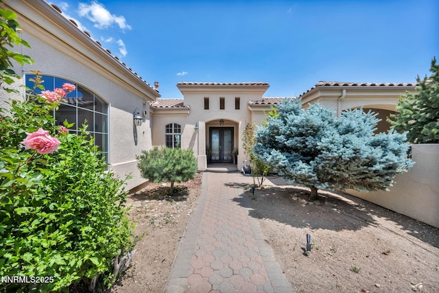14210 Wild Quail Ct, Reno, NV 89511 - entrance to property featuring french doors, a tile roof, and stucco siding