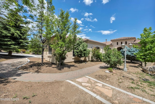 14210 Wild Quail Ct, Reno, NV 89511 - view of front facade featuring stucco siding and a tiled roof