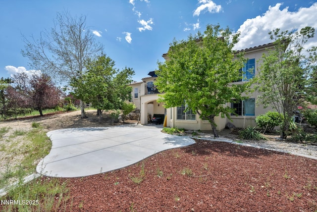 14210 Wild Quail Ct, Reno, NV 89511 - back of house featuring stucco siding and a patio area