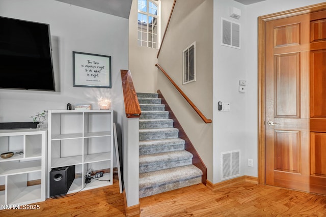 14210 Wild Quail Ct, Reno, NV 89511 - stairs featuring wood finished floors and baseboards