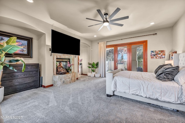 14210 Wild Quail Ct, Reno, NV 89511 - carpeted bedroom featuring access to exterior, recessed lighting, a ceiling fan, and a tiled fireplace
