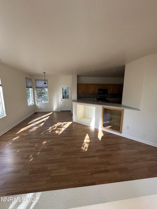 4748 Cedarhill Ln, Reno, NV 89519 - unfurnished living room with baseboards and dark wood-style floors