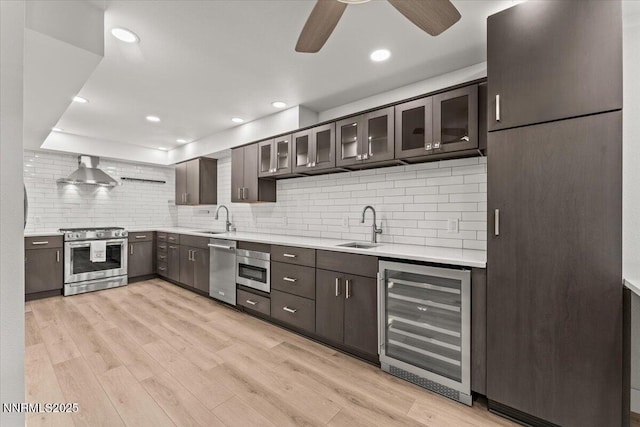 1308 Jones St, Reno, NV 89503 - kitchen featuring stainless steel appliances, beverage cooler, a sink, light countertops, and recessed lighting