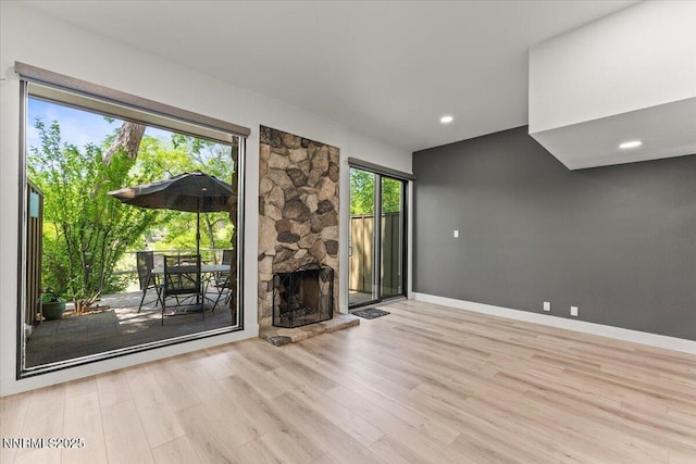 1308 Jones St, Reno, NV 89503 - unfurnished living room featuring wood finished floors, baseboards, and a fireplace