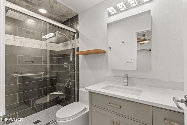 1308 Jones St, Reno, NV 89503 - bathroom with toilet, vanity, a shower stall, and ceiling fan
