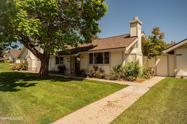 1169 Wagon Wheel Cir, Reno, NV 89503 - view of front of home featuring a shingled roof, a front yard, and a chimney
