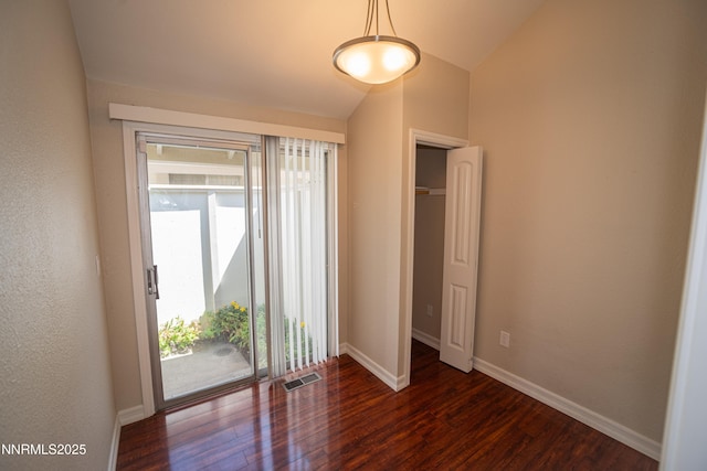 1169 Wagon Wheel Cir, Reno, NV 89503 - unfurnished bedroom with access to outside, dark wood finished floors, and vaulted ceiling