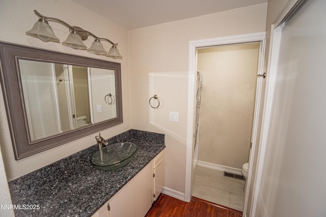 1169 Wagon Wheel Cir, Reno, NV 89503 - bathroom featuring vanity, wood finished floors, and a shower with curtain