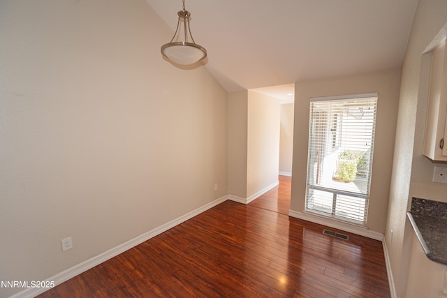 1169 Wagon Wheel Cir, Reno, NV 89503 - unfurnished dining area with dark wood-style floors and lofted ceiling