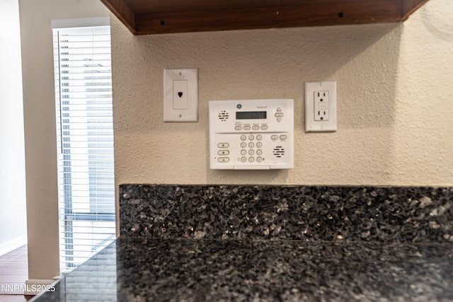 1169 Wagon Wheel Cir, Reno, NV 89503 - detailed view of dark countertops and a textured wall