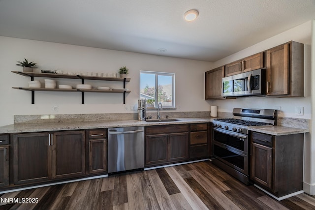 18105 Pasado Ct, Reno, NV 89508 - kitchen featuring appliances with stainless steel finishes, a sink, open shelves, dark wood-style floors, and dark brown cabinetry