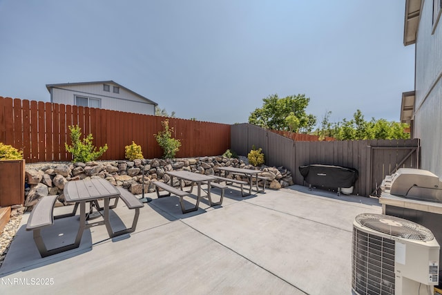 18105 Pasado Ct, Reno, NV 89508 - fenced backyard with a patio and central AC unit