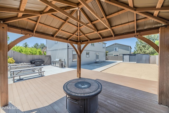 18105 Pasado Ct, Reno, NV 89508 - wooden terrace featuring a fenced backyard, a gazebo, and a patio area