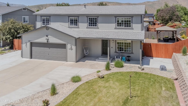 18105 Pasado Ct, Reno, NV 89508 - traditional-style home featuring roof with shingles, a gazebo, driveway, and a mountain view