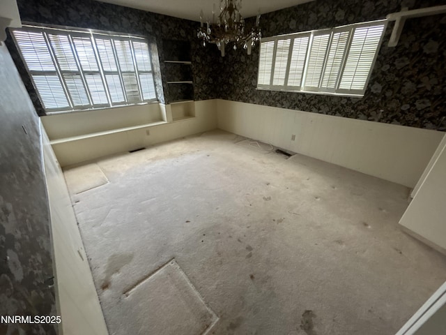 3411 San Juan Dr, Reno, NV 89509 - unfurnished dining area featuring wallpapered walls and a chandelier