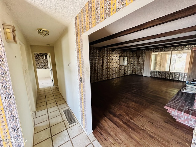 3411 San Juan Dr, Reno, NV 89509 - corridor featuring wallpapered walls, wood finished floors, a textured ceiling, beamed ceiling, and baseboards