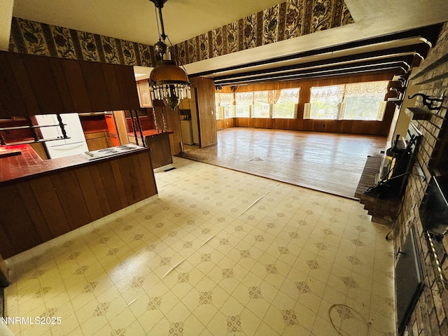 3411 San Juan Dr, Reno, NV 89509 - kitchen with light floors and pendant lighting