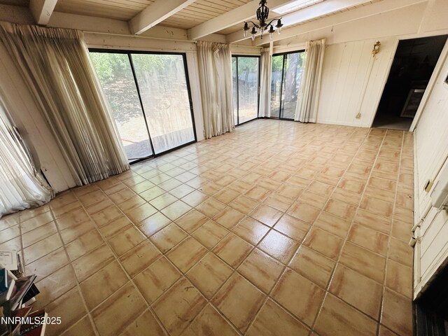 3411 San Juan Dr, Reno, NV 89509 - spare room featuring beamed ceiling and a chandelier