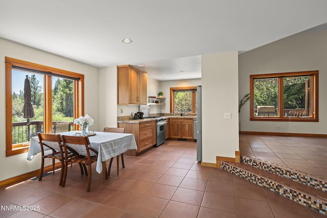 16460 Jefte Ct, Reno, NV 89511 - kitchen featuring high end stainless steel range oven, open shelves, light tile patterned floors, recessed lighting, and light countertops