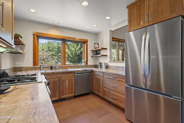 16460 Jefte Ct, Reno, NV 89511 - kitchen featuring appliances with stainless steel finishes, open shelves, brown cabinets, tile patterned flooring, and recessed lighting