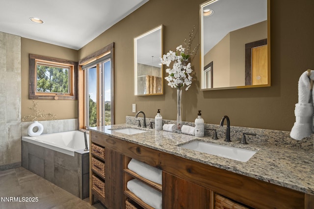 16460 Jefte Ct, Reno, NV 89511 - bathroom featuring a bath, double vanity, and recessed lighting