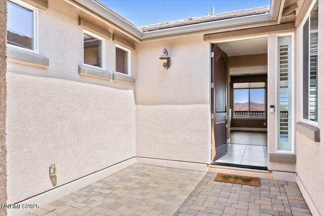 1080 S University Park Loop, Reno, NV 89512 - doorway to property featuring stucco siding