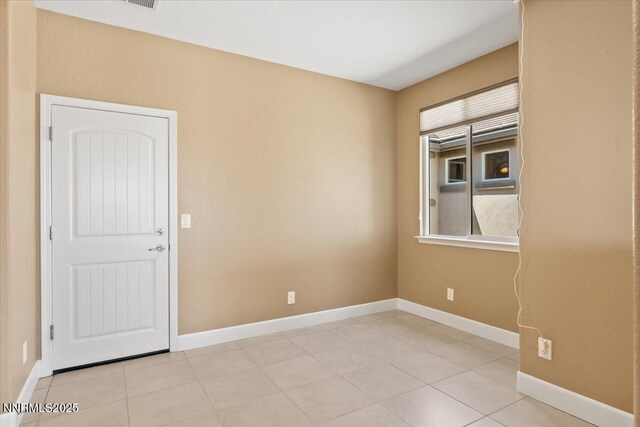 1080 S University Park Loop, Reno, NV 89512 - unfurnished room featuring light tile patterned floors and baseboards