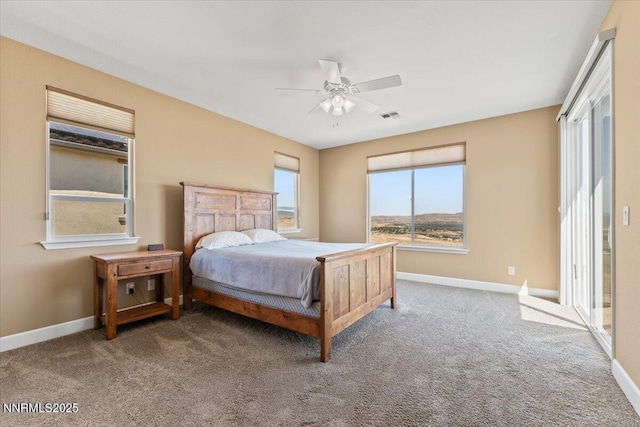 1080 S University Park Loop, Reno, NV 89512 - bedroom featuring baseboards, carpet floors, and a ceiling fan