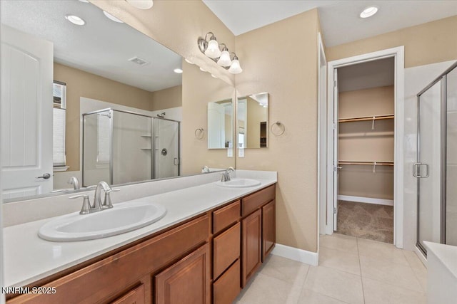 1080 S University Park Loop, Reno, NV 89512 - full bath featuring a shower stall, double vanity, tile patterned flooring, and recessed lighting