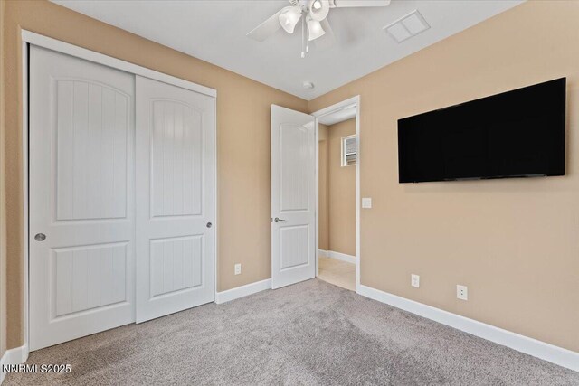 1080 S University Park Loop, Reno, NV 89512 - unfurnished bedroom with carpet floors, baseboards, a closet, and a ceiling fan