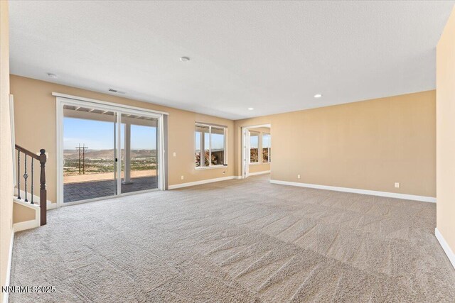 1080 S University Park Loop, Reno, NV 89512 - carpeted spare room with baseboards, recessed lighting, and stairs