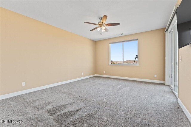 1080 S University Park Loop, Reno, NV 89512 - carpeted spare room featuring a ceiling fan and baseboards