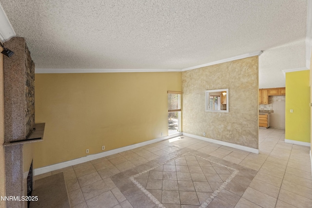 779 E York Way, Sparks, NV 89434 - empty room featuring crown molding, light tile patterned flooring, baseboards, and a textured ceiling