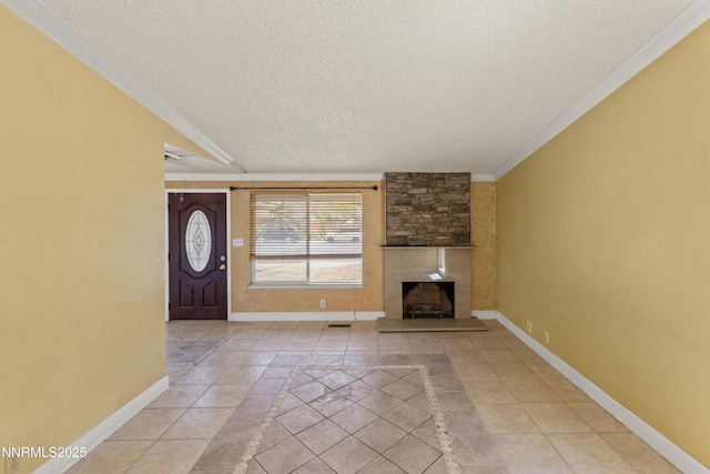 779 E York Way, Sparks, NV 89434 - unfurnished living room featuring a textured ceiling, baseboards, inlaid floor details, a large fireplace, and ornamental molding