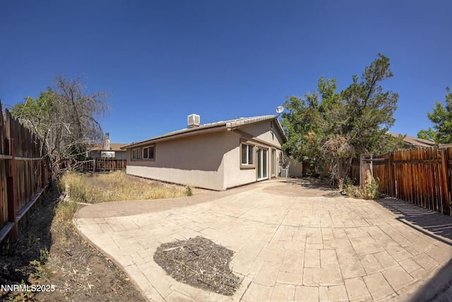 779 E York Way, Sparks, NV 89434 - rear view of house with stucco siding, a patio area, and a fenced backyard