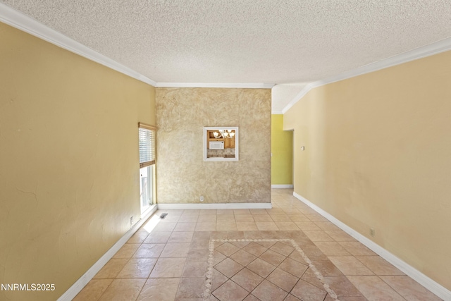 779 E York Way, Sparks, NV 89434 - spare room featuring ornamental molding, a textured ceiling, baseboards, inlaid floor details, and light tile patterned floors