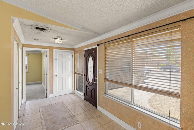 779 E York Way, Sparks, NV 89434 - entrance foyer with a textured ceiling, baseboards, plenty of natural light, ornamental molding, and inlaid floor details