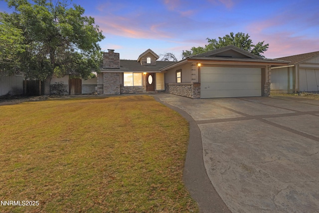 779 E York Way, Sparks, NV 89434 - ranch-style house with stone siding, a garage, driveway, a chimney, and a front yard