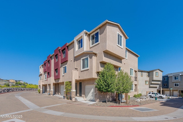 3002 Sterling Ridge Cir, Sparks, NV 89431 - view of building exterior with a residential view and a garage