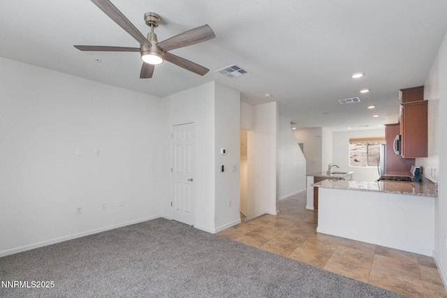 3002 Sterling Ridge Cir, Sparks, NV 89431 - unfurnished living room featuring a sink, a ceiling fan, baseboards, recessed lighting, and light carpet
