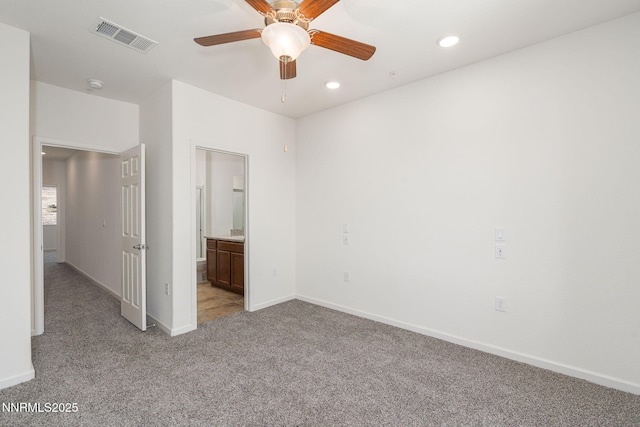 3002 Sterling Ridge Cir, Sparks, NV 89431 - unfurnished bedroom featuring light carpet, baseboards, recessed lighting, ensuite bath, and a ceiling fan