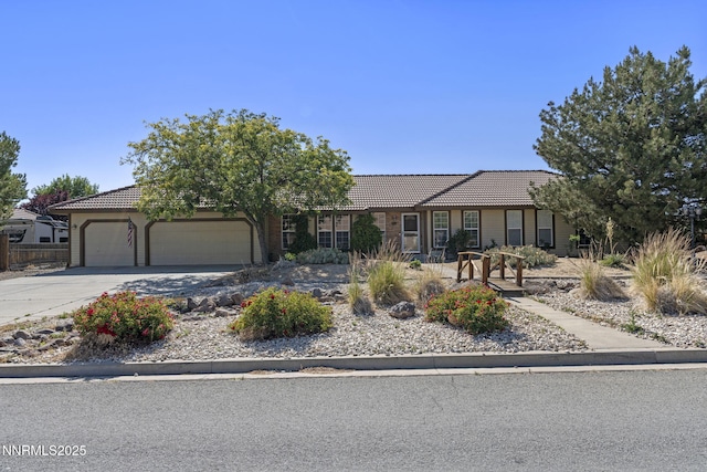 115 Stags Leap Cir, Spanish Springs, NV 89441 - single story home featuring a tile roof, an attached garage, and driveway