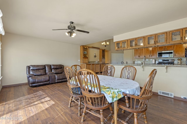 115 Stags Leap Cir, Spanish Springs, NV 89441 - dining space featuring a chandelier, hardwood / wood-style floors, and ceiling fan