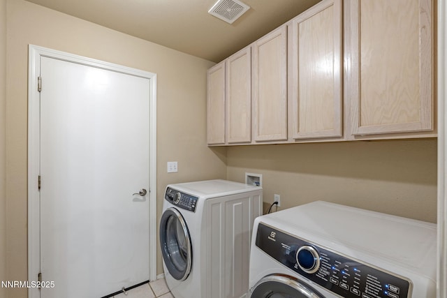 115 Stags Leap Cir, Spanish Springs, NV 89441 - laundry area featuring cabinet space, independent washer and dryer, and light tile patterned floors