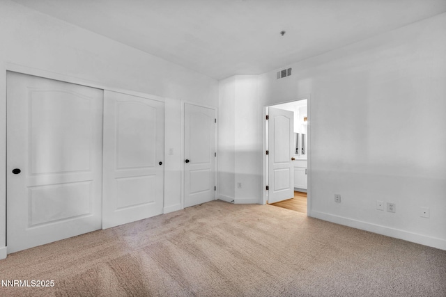 6850 Sharlands Ave # E1017, Reno, NV 89523 - unfurnished bedroom featuring carpet, connected bathroom, and a closet