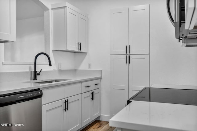 6850 Sharlands Ave # E1017, Reno, NV 89523 - kitchen with dishwasher, light countertops, and white cabinetry