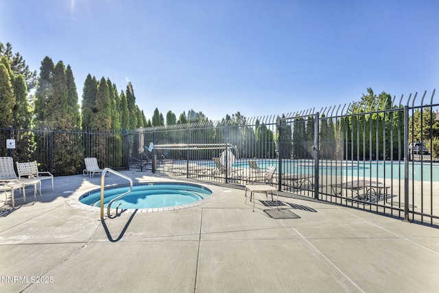 6850 Sharlands Ave # E1017, Reno, NV 89523 - community pool featuring a hot tub and a patio