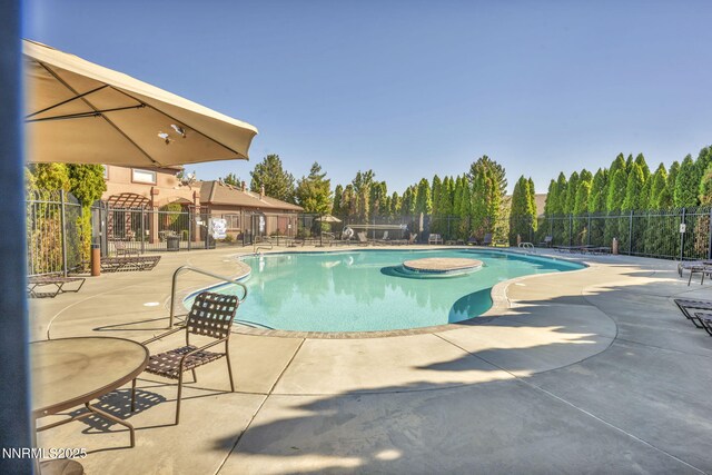 6850 Sharlands Ave # E1017, Reno, NV 89523 - community pool featuring a patio