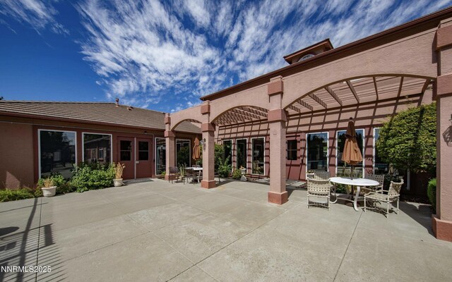 6850 Sharlands Ave # E1017, Reno, NV 89523 - view of patio with outdoor dining area and a pergola